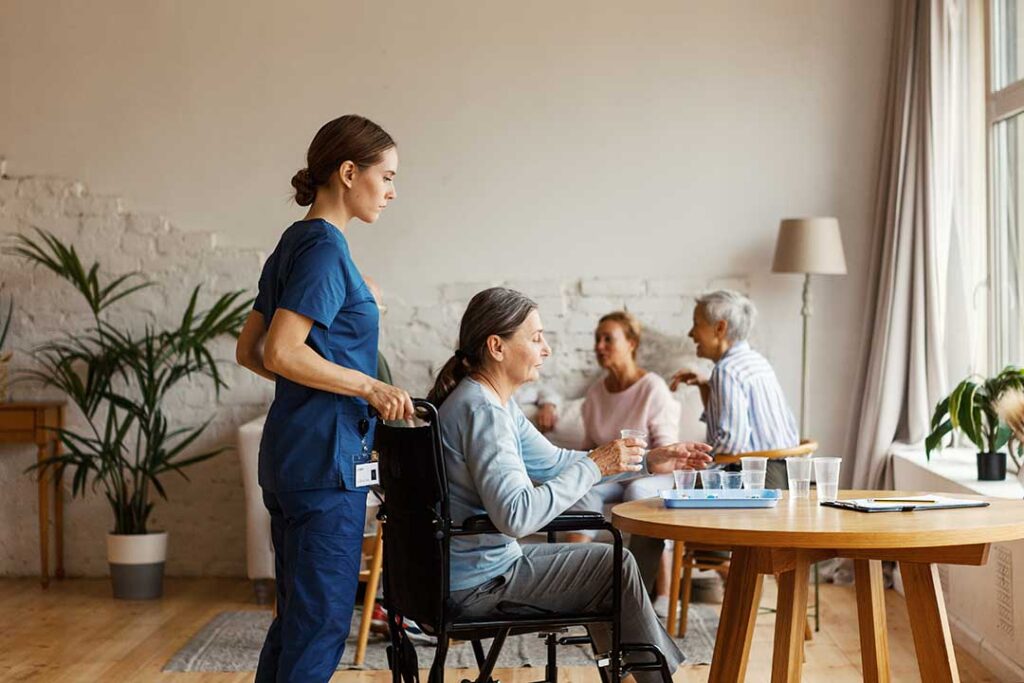 Older adult and family member reviewing an assisted living contract, fee schedule, and deposit receipt at a table.