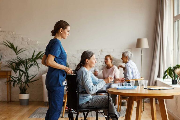 Older adult and family member reviewing an assisted living contract, fee schedule, and deposit receipt at a table.